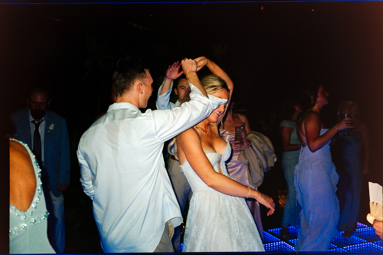 Bride dancing with guests during a destination wedding reception celebration in Tulum Mexico