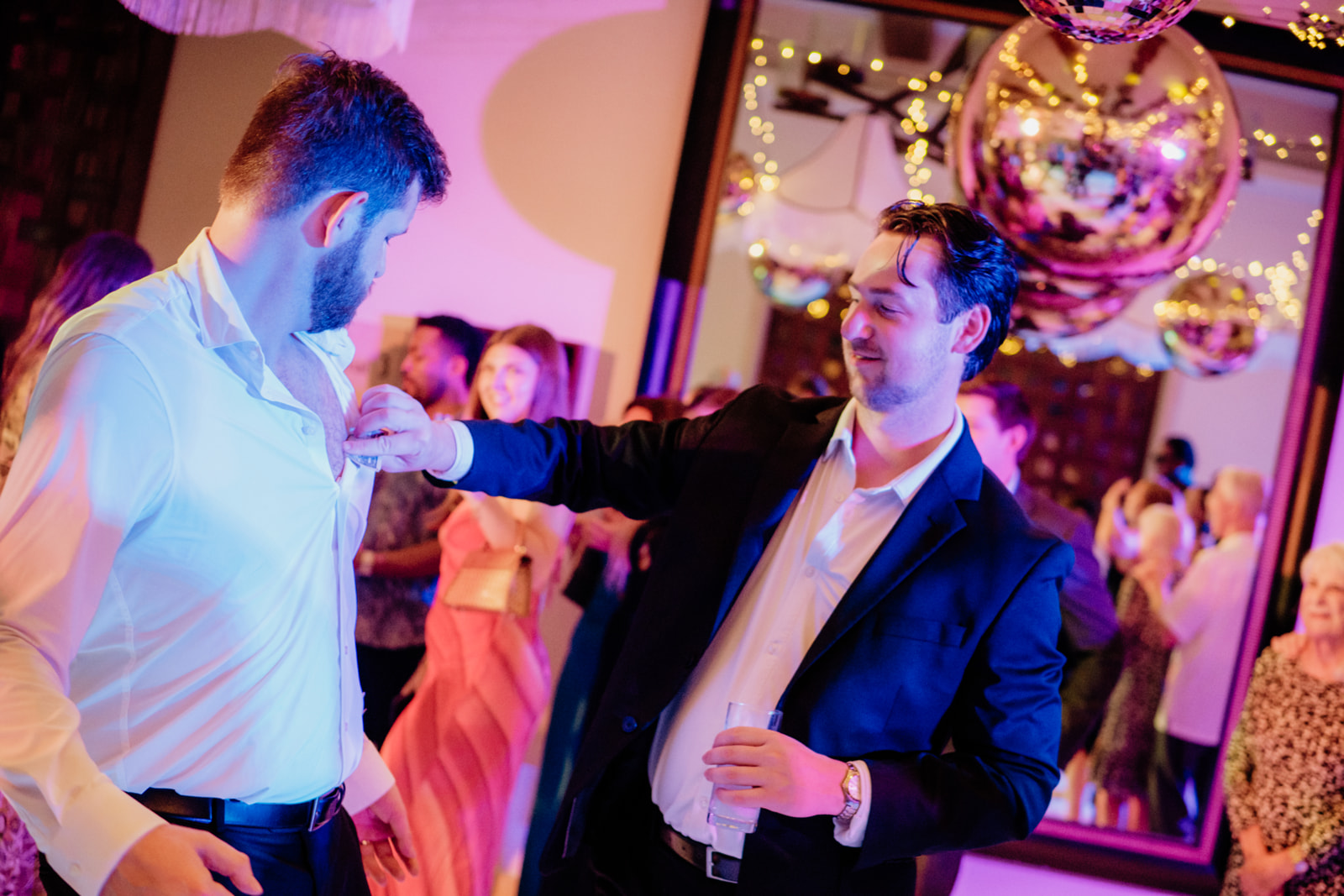 Wedding guests dancing and celebrating during a destination wedding reception in Tulum Mexico