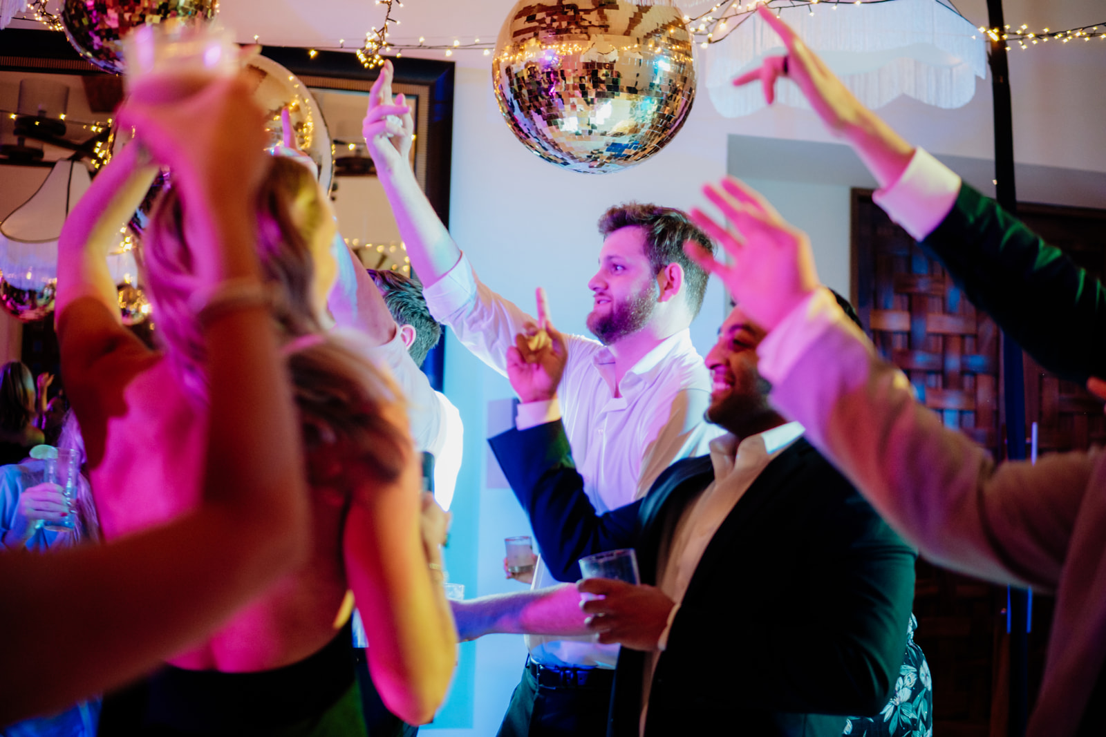 Wedding guests dancing during a destination wedding reception celebration in Tulum Mexico